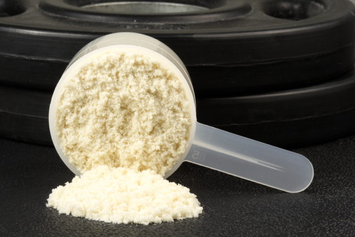 a scoop of white protein powder