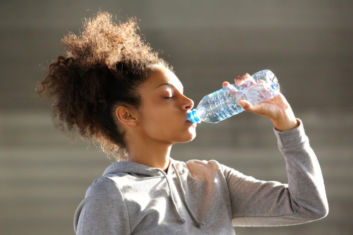 dehydrated woman drinking water